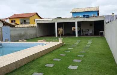 Imagem: A casa possui 2 Banheiros, 5 Vagas na garagem, 95m² de Área