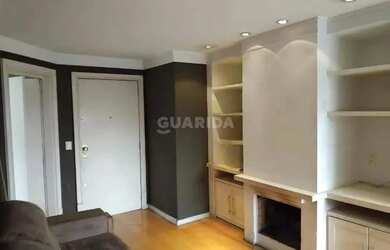 Imagem 5: Apartamento com 1 dormitório, lareira e sacada em bairro arborizado