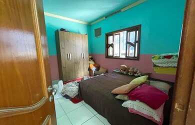 Imagem: A casa possui 3 Dormitórios, 2 Banheiros, 2 Vagas na garagem