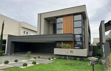 Imagem: A casa em condomínio possui 5 Dormitórios, 5 Banheiros, 2