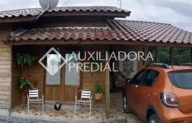 Imagem: A casa possui 2 Dormitórios, 1 Banheiro, 1 Vaga na garagem