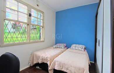 Imagem 9: Casa com três dormitórios com patio grande no bairro Santa Tereza