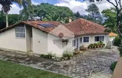 Imagem: A casa possui 5 Dormitórios, 4 Banheiros, 5 Vagas na garagem