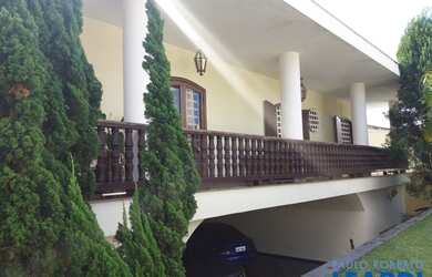 Imagem: A casa possui 5 Dormitórios, 5 Banheiros, 5 Vagas na garagem