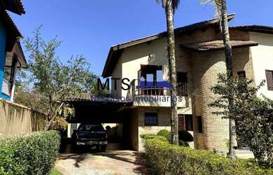 Imagem: A casa possui 5 Dormitórios, 5 Banheiros, 5 Vagas na garagem