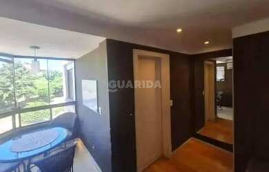 Imagem 3: Apartamento com 1 dormitório, lareira e sacada em bairro arborizado