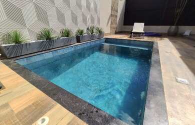 Imagem: A casa possui 3 Dormitórios, 4 Banheiros, 4 Vagas na garagem