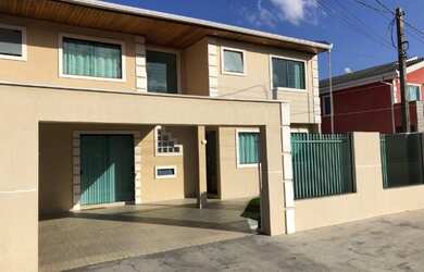 Imagem: A casa possui 2 Dormitórios, 3 Banheiros, 2 Vagas na garagem