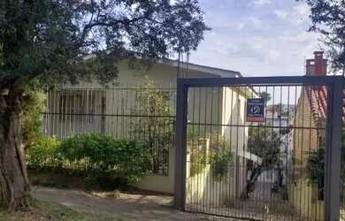 Imagem: A casa possui 3 Dormitórios, 3 Banheiros, 3 Vagas na garagem