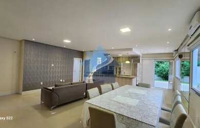 Imagem: A casa possui 3 Dormitórios, 5 Banheiros, 4 Vagas na garagem