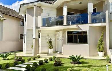 Imagem: A casa em condomínio possui 5 Dormitórios, 5 Banheiros, 3