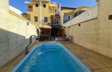 Imagem: A casa possui 3 Dormitórios, 5 Banheiros, 5 Vagas na garagem