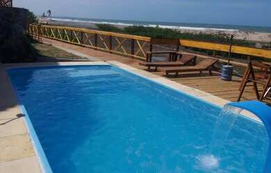 Imagem: A casa possui 5 Dormitórios, 4 Vagas na garagem e está localizado