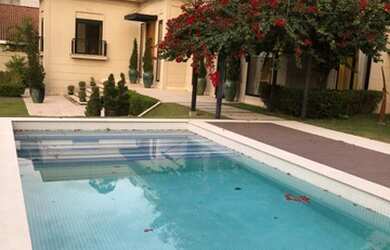 Imagem: A casa possui 5 Dormitórios, 5 Banheiros, 5 Vagas na garagem