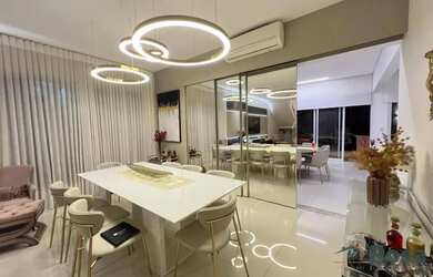 Imagem: A casa possui 3 Dormitórios, 5 Banheiros, 4 Vagas na garagem