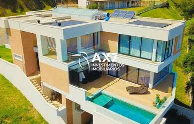 Imagem: A casa em condomínio possui 4 Dormitórios, 5 Banheiros, 4