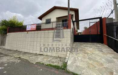 Imagem: A casa possui 2 Dormitórios, 1 Banheiro, 2 Vagas na garagem