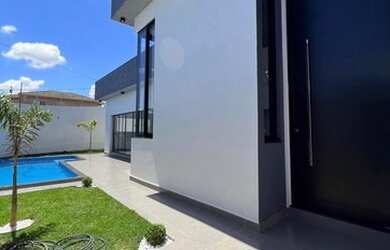 Imagem: A casa possui 3 Dormitórios, 4 Banheiros, 4 Vagas na garagem