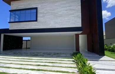 Imagem: A casa possui 4 Dormitórios, 5 Banheiros, 5 Vagas na garagem