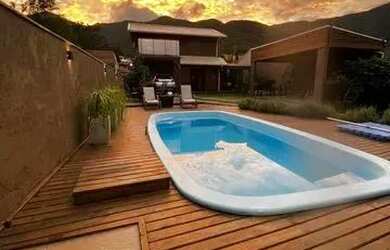 Imagem: A casa possui 3 Dormitórios, 3 Banheiros, 2 Vagas na garagem