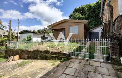 Imagem: A casa e possui 3 Dormitórios, Suítes, 2 Banheiros, 1 Vaga