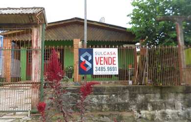 Imagem: A casa possui 2 Dormitórios, 2 Banheiros, 3 Vagas na garagem
