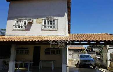 Imagem: A casa possui 3 Dormitórios, 2 Banheiros, 3 Vagas na garagem