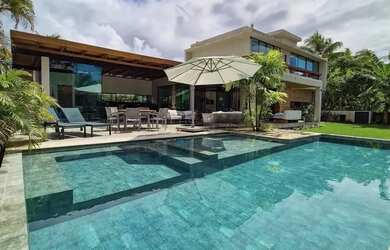 Imagem: A casa possui 4 Dormitórios, 5 Banheiros, 5 Vagas na garagem