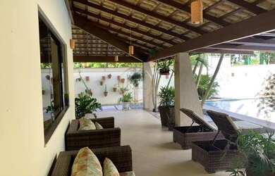 Imagem: A casa possui 4 Dormitórios, 5 Banheiros, 4 Vagas na garagem