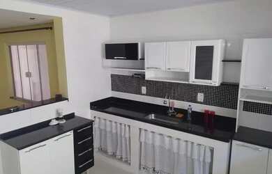 Imagem: A casa possui 4 Dormitórios, 3 Banheiros, 110m² de Área e