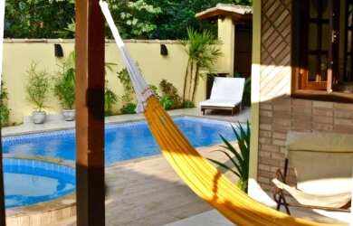 Imagem: A casa possui 5 Dormitórios, 4 Vagas na garagem e está localizado