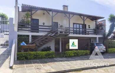 Imagem: A casa possui 4 Dormitórios, 4 Banheiros, 2 Vagas na garagem