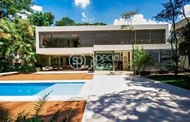 Imagem: A casa possui 4 Dormitórios, 5 Banheiros, 5 Vagas na garagem