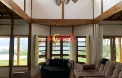 Imagem: A casa possui 4 Dormitórios, 5 Banheiros, 5 Vagas na garagem