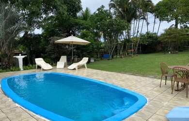 Imagem: A casa possui 2 Dormitórios, 3 Vagas na garagem e está localizado