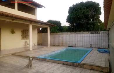 Imagem: A casa possui 4 Dormitórios, 1 Banheiro, 3 Vagas na garagem