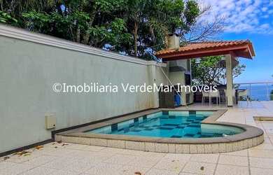 Imagem: A casa possui 3 Dormitórios, 5 Banheiros, 4 Vagas na garagem