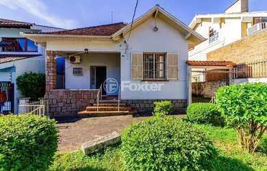 Imagem: A casa possui 3 Dormitórios, 3 Banheiros, 5 Vagas na garagem