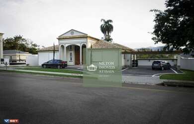 Imagem: A casa em condomínio possui 5 Dormitórios, 5 Banheiros, 5