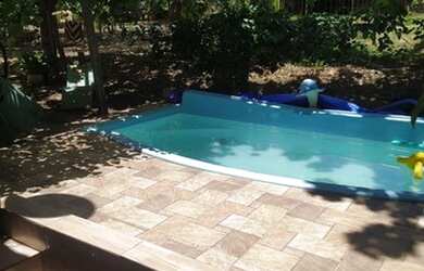 Imagem: A casa possui 2 Dormitórios, 4 Vagas na garagem e está localizado