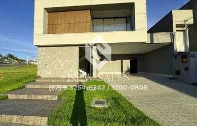 Imagem: A casa possui 4 Dormitórios, 5 Banheiros, 4 Vagas na garagem