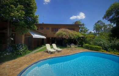 Imagem: A casa em condomínio possui 4 Dormitórios, 5 Banheiros, 5