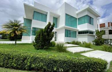 Imagem: A casa possui 4 Dormitórios, 5 Banheiros, 5 Vagas na garagem