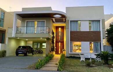 Imagem: A casa possui 4 Dormitórios, 5 Banheiros, 4 Vagas na garagem