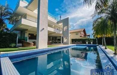 Imagem: A casa possui 5 Dormitórios, 5 Banheiros, 5 Vagas na garagem