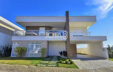 Imagem: A casa em condomínio possui 4 Dormitórios, 5 Banheiros, 4