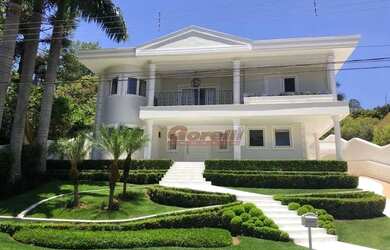 Imagem: A casa em condomínio possui 5 Dormitórios, 5 Banheiros, 4