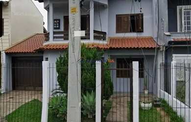 Imagem: A casa possui 3 Dormitórios, 3 Banheiros, 2 Vagas na garagem