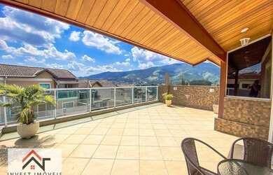 Imagem: A casa possui 3 Dormitórios, 2 Banheiros, 2 Vagas na garagem