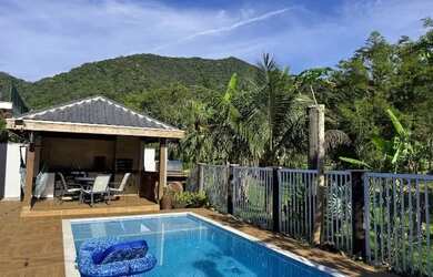 Imagem: A casa em condomínio à venda possui 5 Dormitórios, 4 Banheiros